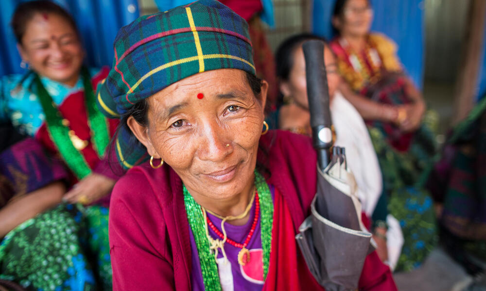 A community member attending the community meeting with Marcia Marsh, WWF-US Chief Operating Officer, held at the rebuilt Jivanjyoti Lower Secondary School in the Gorkha District of Nepal.