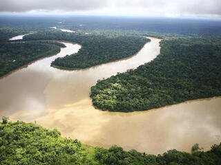 Winding river in Amazon rainforest