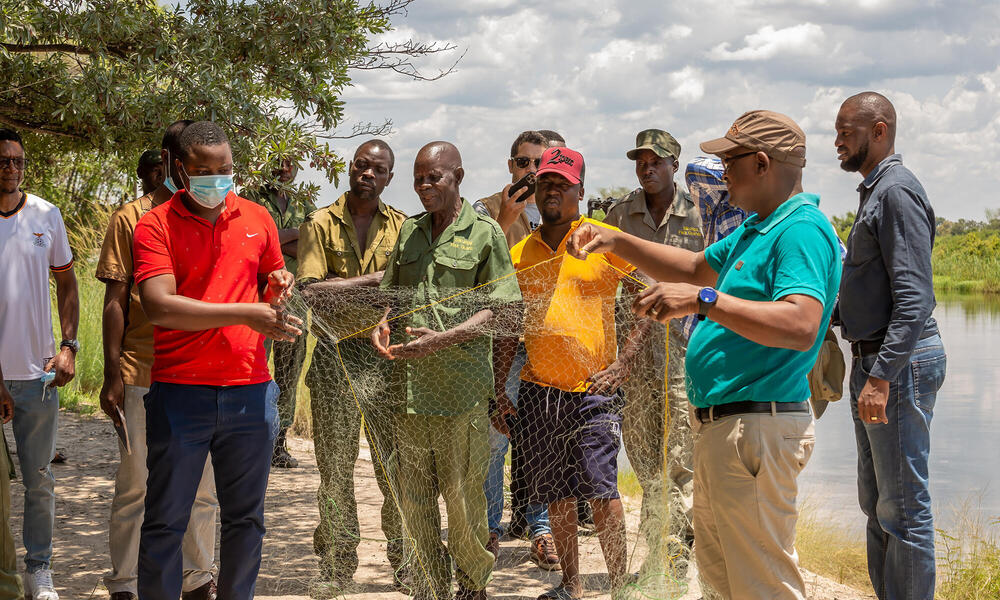 Men holding a fishing net