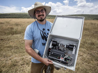 Eric Becker, Conservation Technology Engineer at WWF US, holding his thermal imaging rehoused FLIR camera. As part of WWF's Wildlife Crime Technology project.