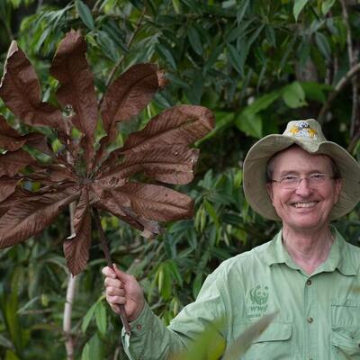 Thomas Lovejoy holding leaf