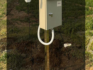 Station equipment standing in field