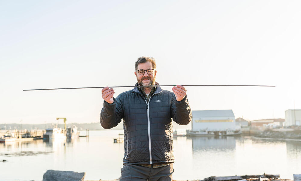 Man holding carbon rod