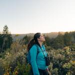 Annika Terrana stands in a meadow