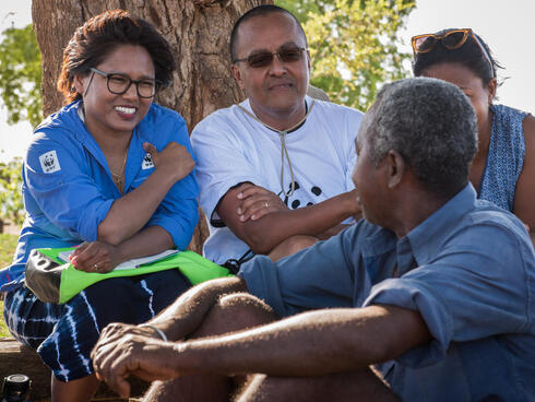 WWF staff members talk with locals.