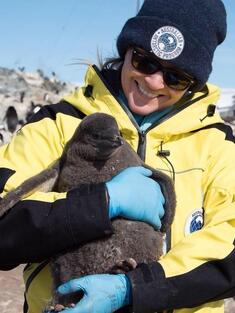 Emily holding a penguin