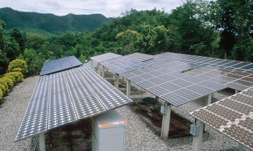 Solar panels in mountain landscape