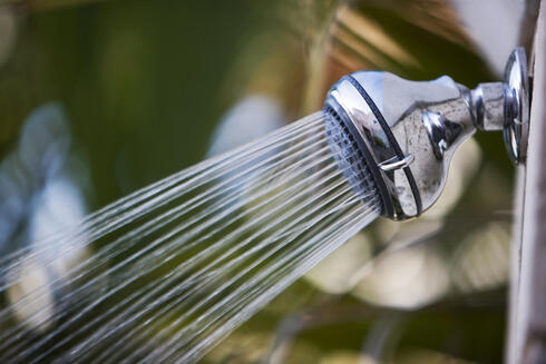 Water flowing from a shower head