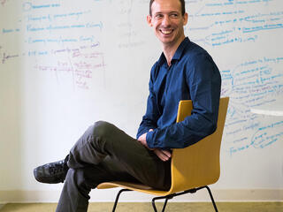 Arnaud Lyet sitting in a chair