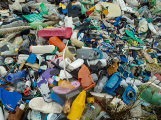 A variety of plastic trash gathered on a beach