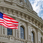 Washington DC Capitol dome detail with waving american flag