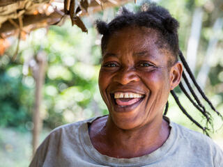 Marie Louise Banyanga, who owns model farm in Mankato, Democratic Republic of the Congo smiles at the camera