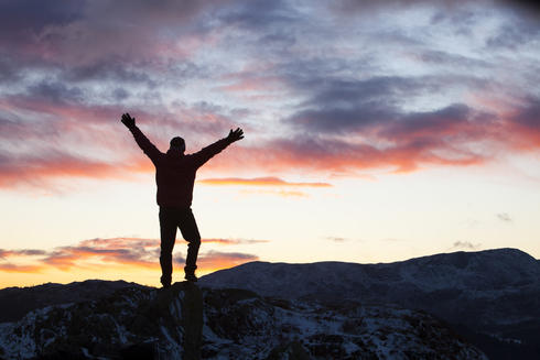 Mountain climber at sunset